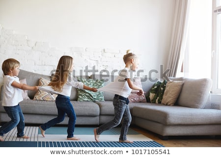 Stok fotoğraf: Two Children Playing In The Living Room