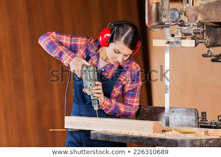 [[stock_photo]]: Girl With Electric Saw