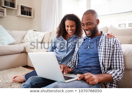 Stock fotó: Young Happy Smiling Couple Looking At Clothes