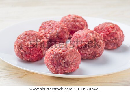 Сток-фото: Raw Meatballs On White Plate Cooking In Kitchen