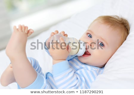 Zdjęcia stock: A Baby Drinking From A Milk Bottle