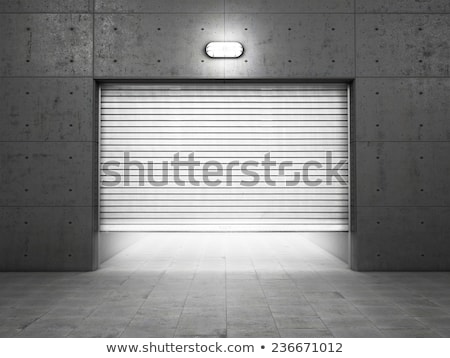 Foto stock: Spotlight Illuminate Of Roller Shutter Door