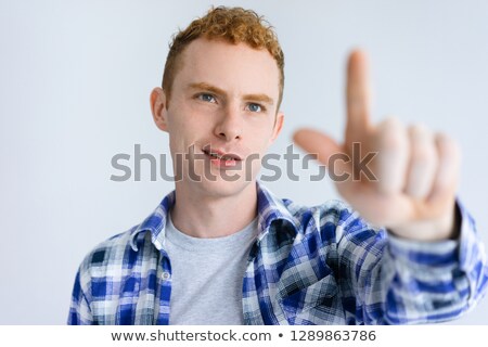 Сток-фото: Man Pretending To Touch An Invisible Screen