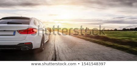 Stok fotoğraf: Cars On A Highway At Sunset