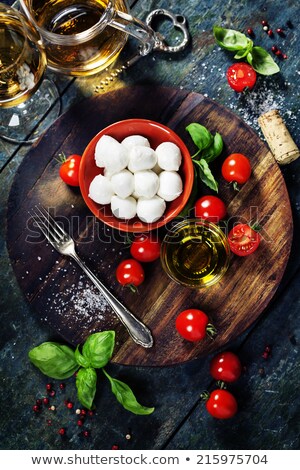 Stockfoto: Caprese Salad With Tomatoes Basil And Mozzarella With Wine