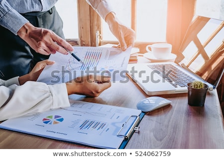 Stockfoto: Business Team Working With Computer Document Graph In Team Meet