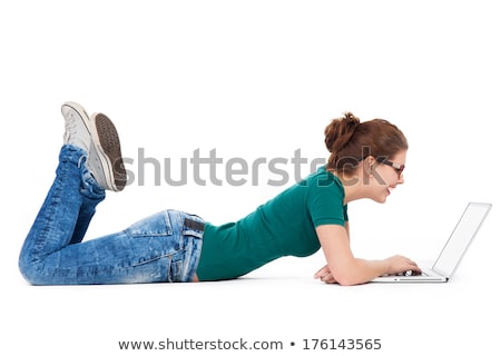 Stock photo: Smiling Teenager Lying Down With Laptop