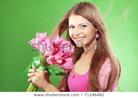 Foto stock: Smiling Teenager Girl With Pink Tulips Bouquet