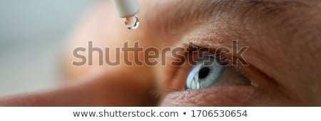 Stock fotó: Caring For Eyes With Eye Drops