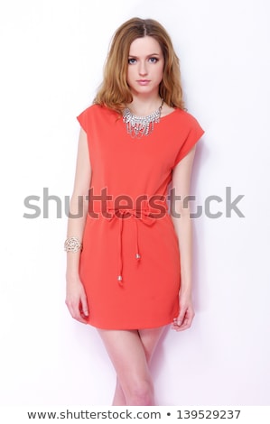 Сток-фото: Attractive Girl In A Smart Dress Red