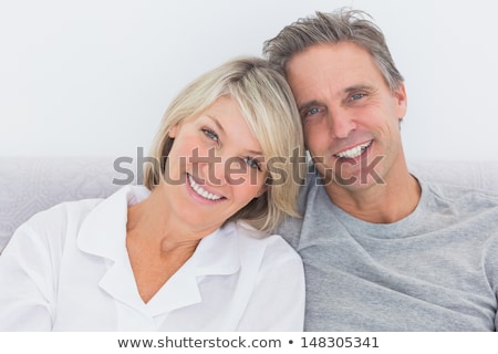 Stock foto: Portrait Of Happy Couple Lying On Bed At Home