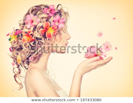 Zdjęcia stock: Woman With A Pink Flower In Her Hand