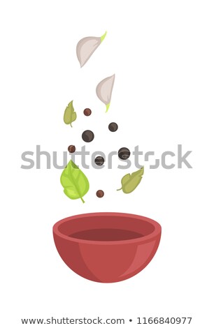 商業照片: Spice Falling Down Into Wood Bowl Vector Badge