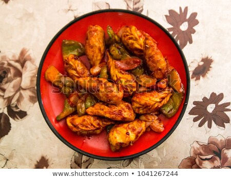 Foto stock: Chicken In Tomato Garlic Sauce