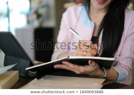 [[stock_photo]]: Crop Businesswoman With Tablet Writing In Notepad