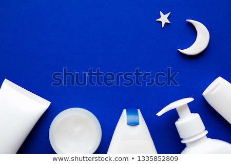 Stock photo: Face Cream Moisturizer Jar On Blue Background Moisturizing Skin