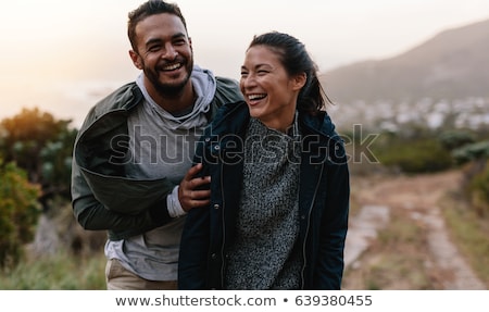 Foto d'archivio: Two Young Men Hiking In Countryside Together