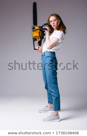 ストックフォト: Person Hold Chainsaw