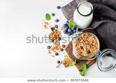 Zdjęcia stock: Healthy Breakfast Fresh Granola Muesli With Berries Honey And Milk In A Wooden Bowl