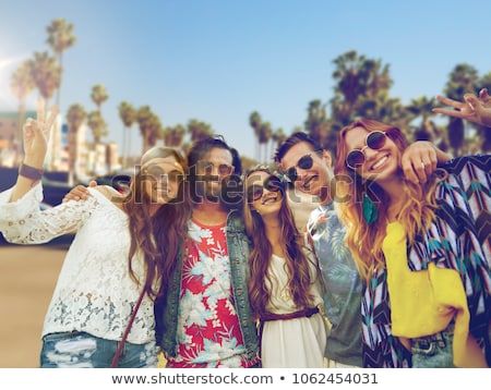 Stock foto: Hippie Friends Showing Peace Over Venice Beach