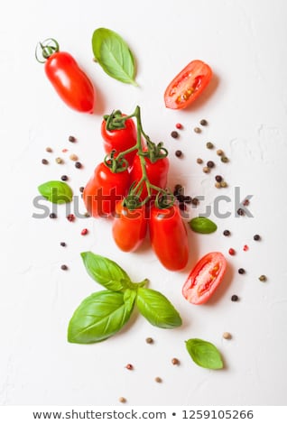Foto stock: Organic Tomatoes On The Vine With Basil And Pepper On White Kitchen Background Close Up Macro