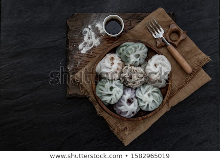 Foto stock: Delicious Mixed Kinds Of Chinese Dumplings Served On Wooden Stands