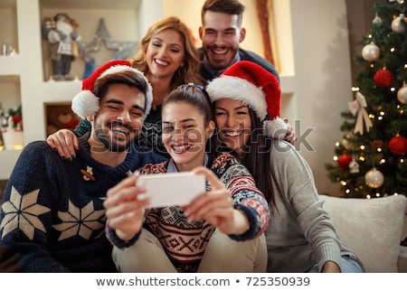 Stock fotó: Couple Making Selfie Photos With Phone On Christmas