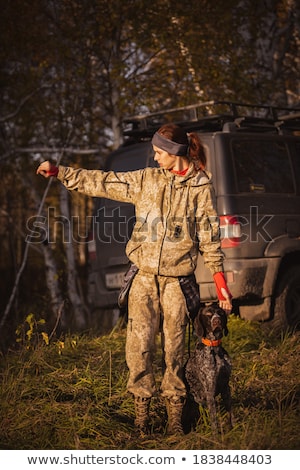 Foto stock: Woman Hunter In The Woods