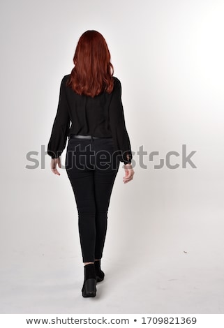 Stockfoto: Portrait Of Beautiful Red Haired Woman Posing At Camera And Touching By Arms With Red Manicure Her F