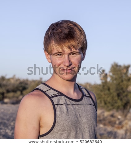 Foto stock: Sunset With Smiling Attractive Boy In Joshua Tree Landscape