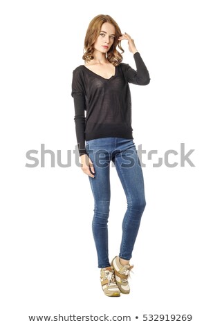 Foto stock: Attractive Young Girl In Jeans Studio Shot