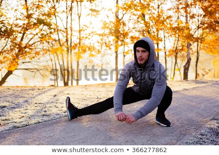 Stock fotó: Hooded Man Jogging In The Park