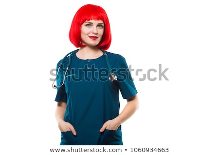Foto stock: Attractive Funny Smilling Caucasian Brunette Female Doctor In Red Wig And Red Sunglasses Standing In