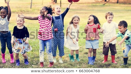 Stok fotoğraf: Kids Playing At Playground