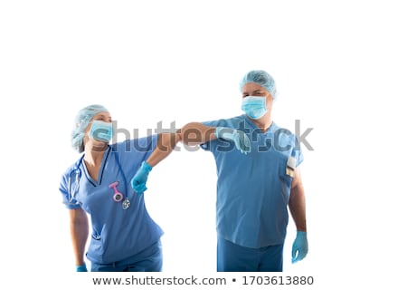 Foto d'archivio: Doctor And Nurse Elbow Bump Instead Of Shaking Hands During Infl