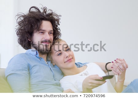 Couple With Remote Control Foto stock © dotshock