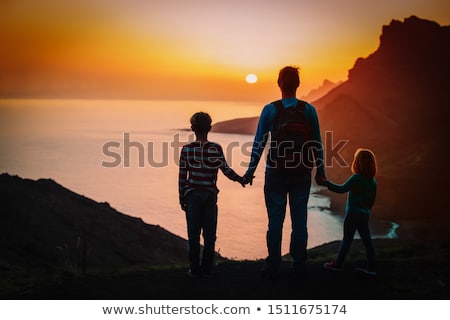 Foto stock: Young Boy Enjoys The Ocean