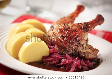 Stock photo: Roast Duck With Potato Dumplings And Red Cabbage