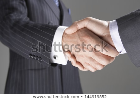 Stock fotó: Midsection Of Business People Shaking Hands