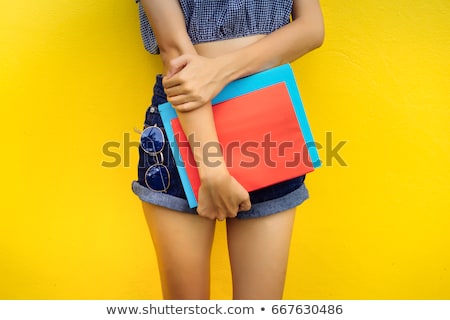 Stok fotoğraf: Woman With Beauty Leg Holding A Book