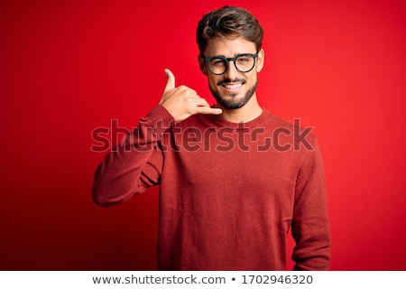 Zdjęcia stock: Portrait Of A Joyful Man Standing Over Red Background