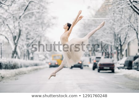 Beautiful Ballerina Is Dancing On Street Of Snowy City Imagine de stoc © Stasia04