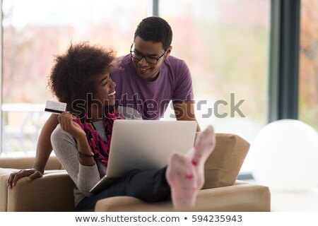 Schwarze Frau mit Kreditkarte und Laptop Stock foto © dotshock