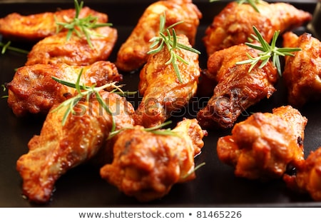 Stock fotó: Delicious Juicy Chicken Wings On Outdoors Grill