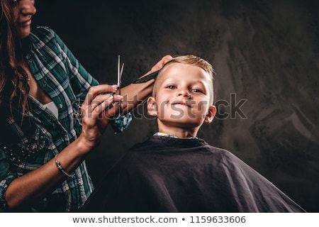 Foto stock: Young Boy At The Hairdresser