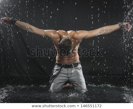 Stok fotoğraf: Muscular Man With Chain On Black Background
