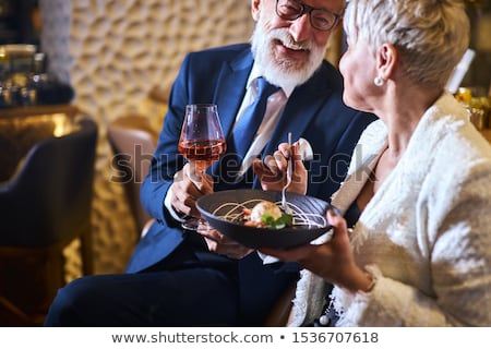 Stock photo: Senior Couple Toasting Glass Of Wine