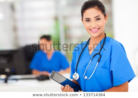 Foto stock: Beautiful Friendly And Confident Nurse Smiling