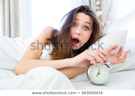 Сток-фото: Shocked Woman Waking Up With Alarm