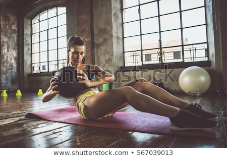 Stock photo: Young Bodybuilder Training With A Young Woman